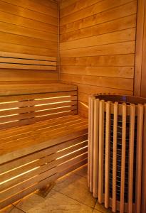 a corner of a sauna with a heater at Atrium Hotel Heathrow in Hillingdon