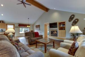 a living room with a couch and a table at 1 Landrise in Sunriver