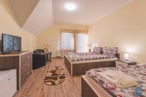 Ein Bett oder Betten in einem Zimmer der Unterkunft Farkas Panzió