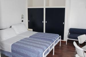 Postel nebo postele na pokoji v ubytování Hotel Nettuno