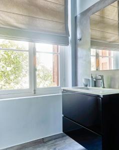 a bathroom with a sink and a window at Villa Sanyan - Adults Only in Rhodes Town