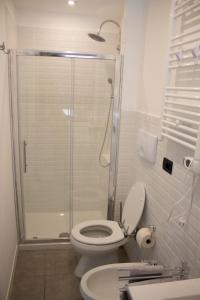 a bathroom with a shower and a toilet and a sink at Rho-Fiera - Appartamento in antica cascina in Pero