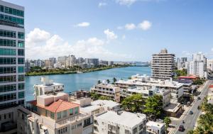 a view of a river in a city with buildings at Condado Vanderbilt Hotel in San Juan