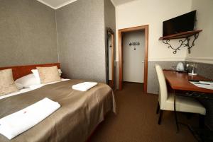 Łóżko lub łóżka w pokoju w obiekcie Hotel Roudna