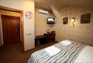 Łóżko lub łóżka w pokoju w obiekcie Hotel Roudna