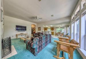 a living room with a couch and a table at The Trout River House in New Braunfels