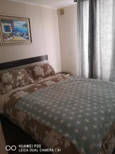 Un pat sau paturi într-o cameră la Relajado y central