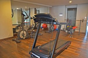 a gym with several exercise equipment in a room at CDM Temporal in Rosario