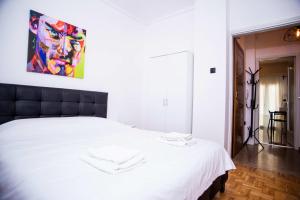Posteľ alebo postele v izbe v ubytovaní Thessaloniki Center Apartment On The Sea