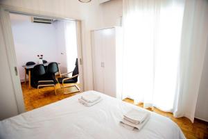 Posteľ alebo postele v izbe v ubytovaní Thessaloniki Center Apartment On The Sea