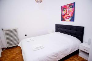 Posteľ alebo postele v izbe v ubytovaní Thessaloniki Center Apartment On The Sea
