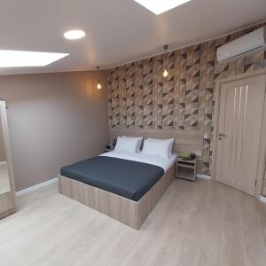Posteľ alebo postele v izbe v ubytovaní Two-Bedroom Apartment near Forum Lviv