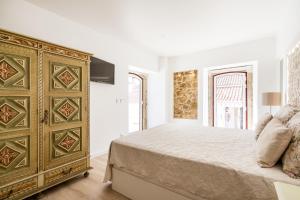 En eller flere senge i et værelse på Casa da Varanda
