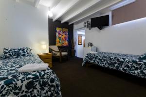 Ein Bett oder Betten in einem Zimmer der Unterkunft Jose Luis Hostal Boutique