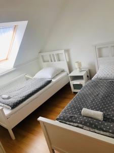 En eller flere senge i et værelse på Tihany Levendula Villa