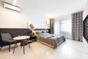 Posteľ alebo postele v izbe v ubytovaní Apartament Silesian Vip Gliwice