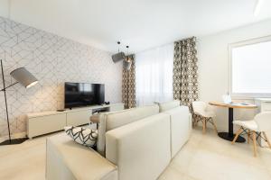 Televízia a/alebo spoločenská miestnosť v ubytovaní Apartament Silesian Vip Gliwice