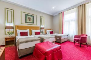 Postel nebo postele na pokoji v ubytování Hotel Caruso Old Town