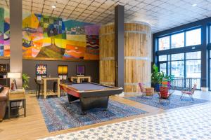 a billiard room with a pool table in the middle at HI New Orleans Hostel in New Orleans