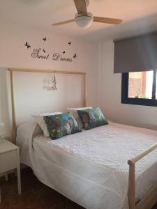 a bedroom with a bed with stars on the wall at Ecorestinga in La Restinga