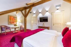 Postel nebo postele na pokoji v ubytování Hotel Caruso Old Town