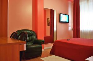 TV a/nebo společenská místnost v ubytování Hotel Rosy