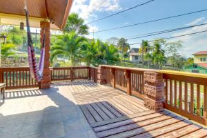 a large deck with wooden railings on a house at Casa de Cahal Pech in San Ignacio