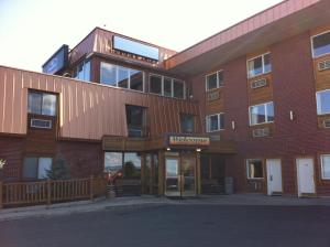 a large brick building with a museum sign on it at Howard Johnson by Wyndham Helena in Helena