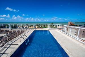 a swimming pool on the top of a cruise ship at Tambau Beach Hotel in João Pessoa