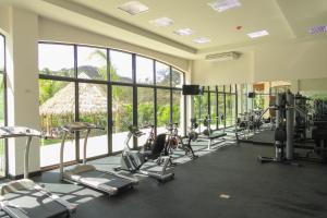a gym with treadmills and elliptical machines at Ocotal Beach Club Hotel 2 in Guanacaste