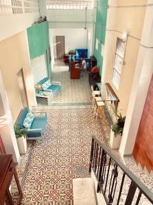 a view of a lobby with chairs and a floor at Casa de la Cruz in Cartagena de Indias