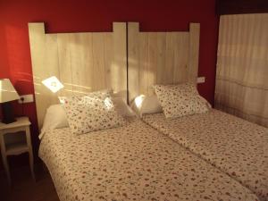 A bed or beds in a room at Casa Los Abetos