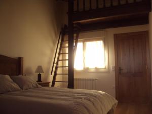 A bed or beds in a room at Casa Los Abetos
