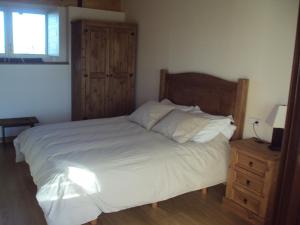 A bed or beds in a room at Casa Los Abetos
