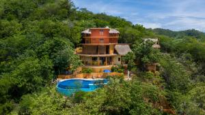 an aerial view of a house in the trees at Casa Biulú in Zipolite