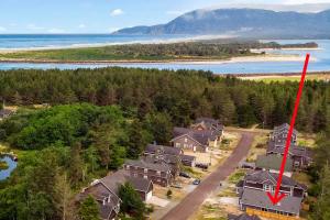 an aerial view of a house with a red arrow at The Captain's Quarters in Rockaway Beach