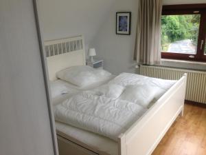เตียงในห้องที่ Haus Liftblick