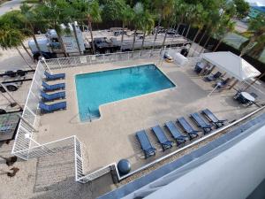 an overhead view of a swimming pool with lounge chairs at Knight's Key Suites in Marathon