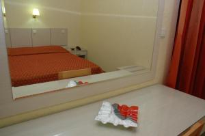 Postel nebo postele na pokoji v ubytování Hotel Pantheon