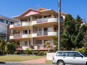 a car parked in front of a building at Haven Waters 6 in Forster