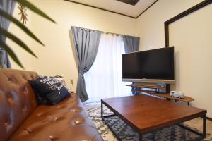 Televízia a/alebo spoločenská miestnosť v ubytovaní TOMARIE Residential Suite Edogawa