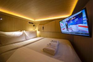 CUBE Boutique Capsule Hotel at Kampong Glam 객실 침대
