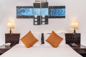 Ένα ή περισσότερα κρεβάτια σε δωμάτιο στο Amethyst Resort Passikudah