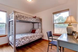 a bedroom with a bunk bed and a desk at Edgewood Getaway in Seaside