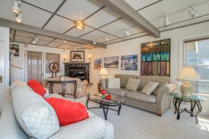 a living room with a couch and a table at Far View in Lincoln City