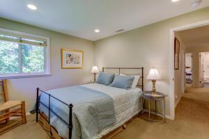 a bedroom with a bed with blue pillows and a window at Dollar Meadows 1372 in Sun Valley +50 photos