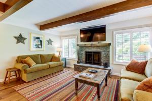 a living room with a couch and a fireplace at Dollar Meadows 1372 in Sun Valley