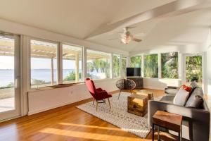 a living room with a view of the ocean at Sunsetter on Sapphire Shores in Sarasota