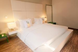Ein Bett oder Betten in einem Zimmer der Unterkunft Seminyak Villa