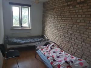 Posteľ alebo postele v izbe v ubytovaní pokoje Łagodzińska